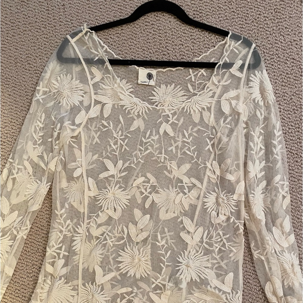 Lacy sheer scalloped top.
